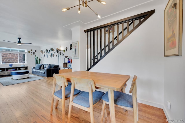 845 Jasmine St, Denver, CO 80220 - dining area featuring stairway, a chandelier, light wood-type flooring, and ceiling fan