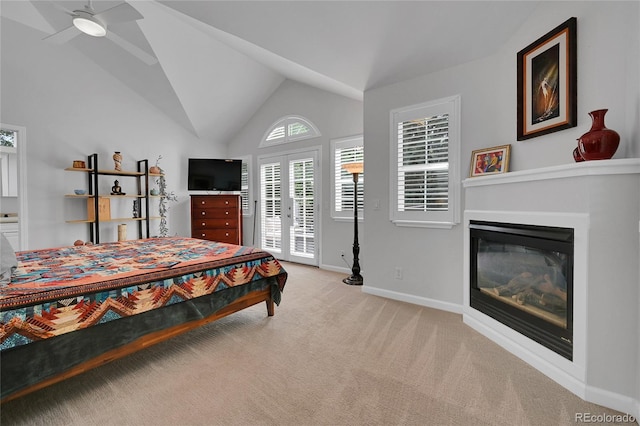 845 Jasmine St, Denver, CO 80220 - bedroom featuring access to outside, light colored carpet, a glass covered fireplace, and lofted ceiling