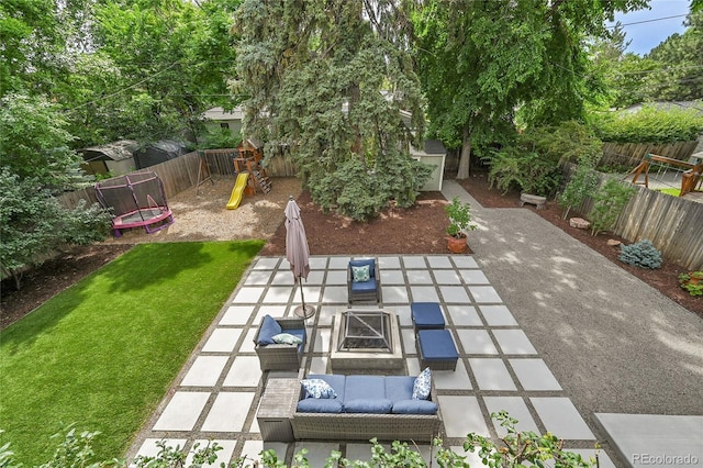 845 Jasmine St, Denver, CO 80220 - fenced backyard with a trampoline, a fire pit, a playground, and a patio