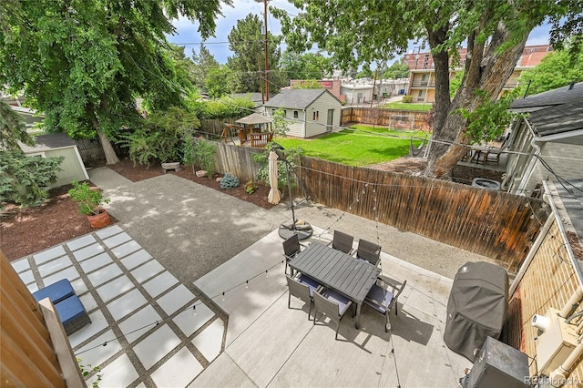 845 Jasmine St, Denver, CO 80220 - fenced backyard with a patio area, an outdoor structure, and outdoor dining area