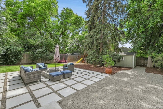 845 Jasmine St, Denver, CO 80220 - fenced backyard featuring a playground, an outdoor hangout area, a patio, and a shed