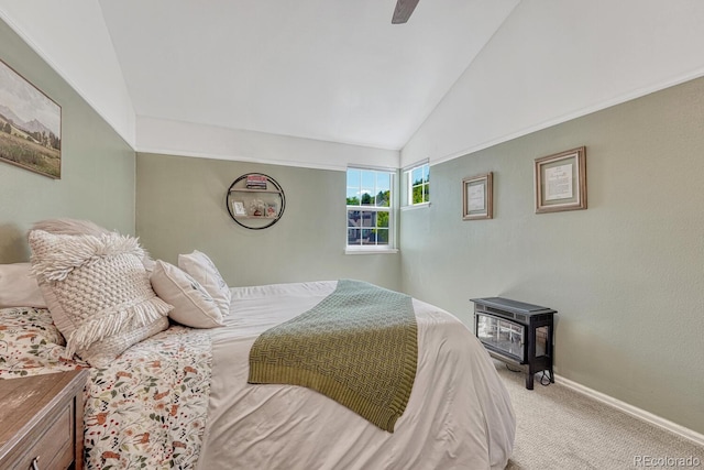 2028 Palm Dr, Colorado Springs, CO 80918 - bedroom featuring lofted ceiling, a wood stove, carpet floors, and a ceiling fan