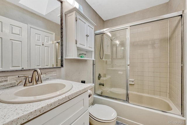2028 Palm Dr, Colorado Springs, CO 80918 - bathroom with vanity, enclosed tub / shower combo, and a skylight