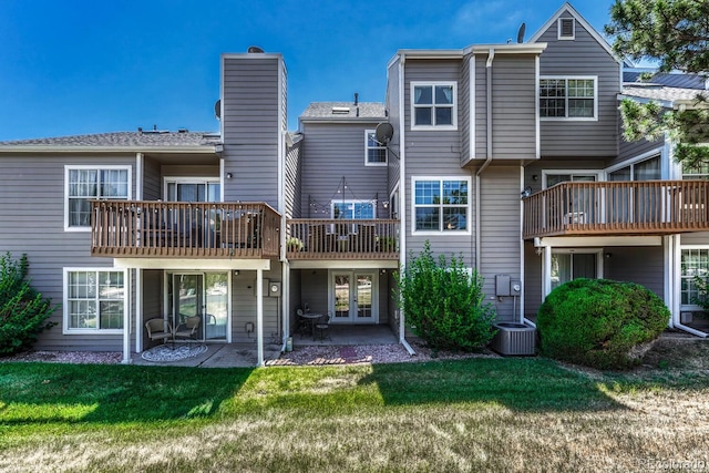 2028 Palm Dr, Colorado Springs, CO 80918 - rear view of property with a yard, a patio, french doors, and a chimney