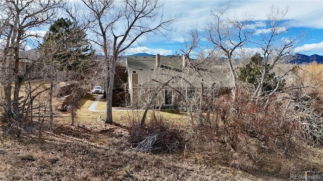 view of side of home featuring a mountain view