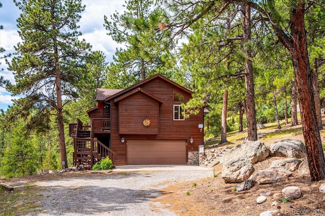 84 Sunny Ridge Ln, Bailey, CO 80421 - view of front of property with stairs, gravel driveway, a garage, and stone siding