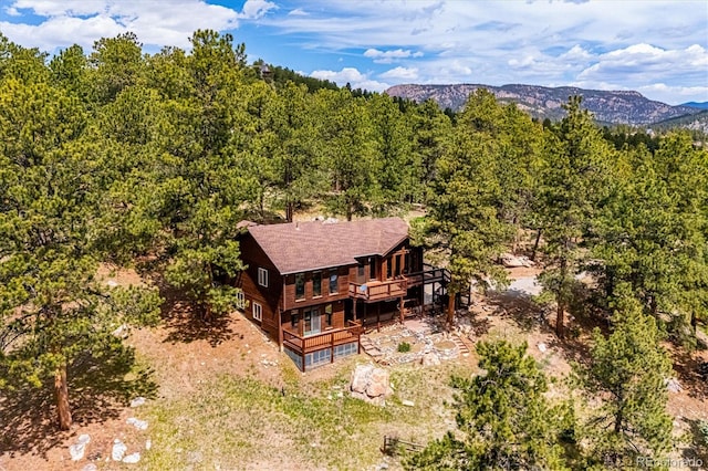 84 Sunny Ridge Ln, Bailey, CO 80421 - view of subject property featuring a heavily wooded area and a mountainous background