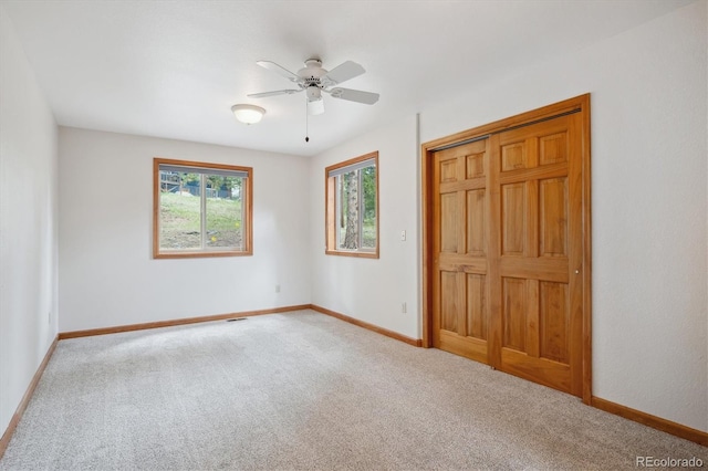 84 Sunny Ridge Ln, Bailey, CO 80421 - unfurnished bedroom featuring carpet, a closet, and a ceiling fan
