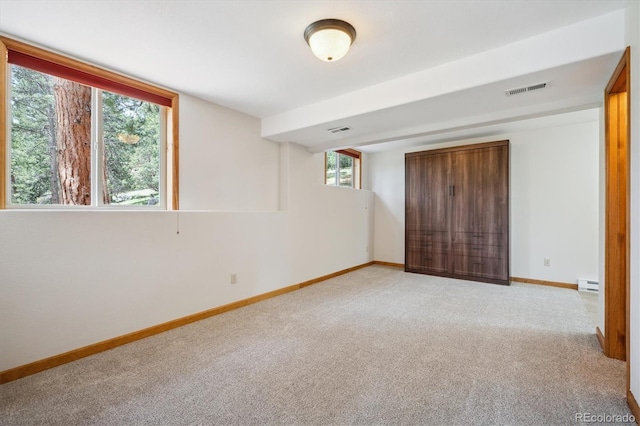 84 Sunny Ridge Ln, Bailey, CO 80421 - unfurnished bedroom with light colored carpet and a baseboard radiator