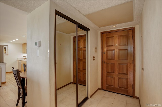 3675 S Cherokee St Unit 710, Englewood, CO 80110 - hallway featuring baseboards, recessed lighting, and a textured ceiling