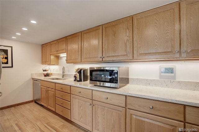 3675 S Cherokee St Unit 710, Englewood, CO 80110 - kitchen featuring stainless steel appliances, a sink, light wood-style flooring, light brown cabinetry, and recessed lighting