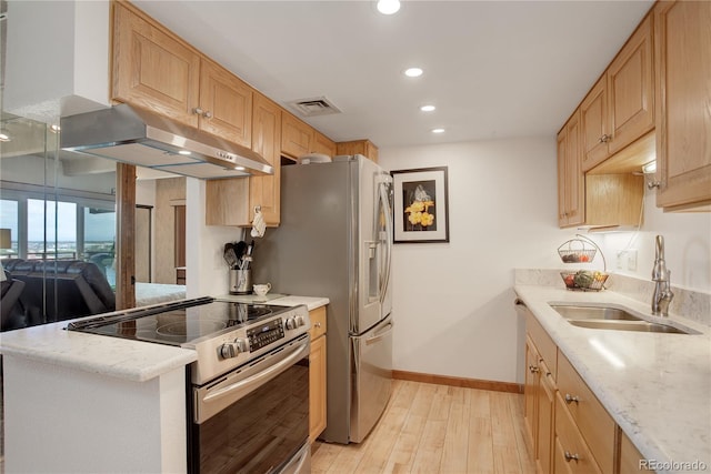 3675 S Cherokee St Unit 710, Englewood, CO 80110 - kitchen with stainless steel electric range, a sink, under cabinet range hood, baseboards, and light wood-type flooring