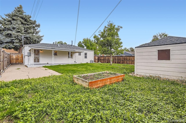 5090 Tejon St, Denver, CO 80221 - view of yard featuring a vegetable garden, a patio area, and central AC
