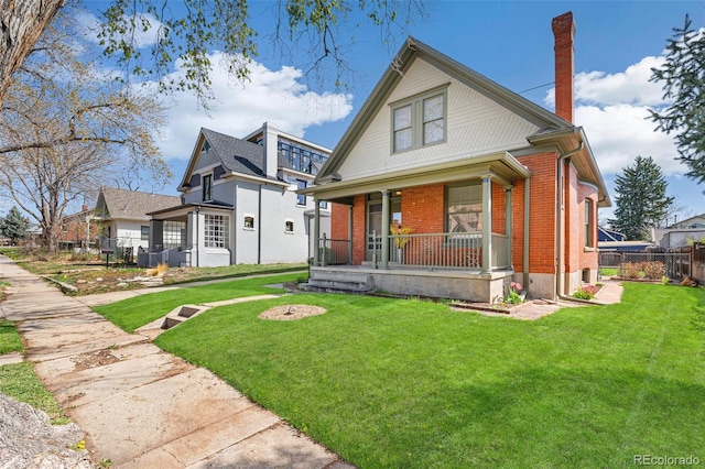 2826 Quitman St, Denver, CO 80212 - bungalow-style home with a porch, brick siding, and a chimney