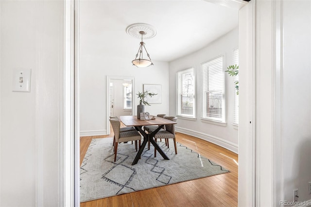 2826 Quitman St, Denver, CO 80212 - dining area featuring baseboards and wood finished floors