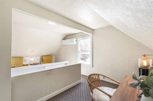 2826 Quitman St, Denver, CO 80212 - home office featuring lofted ceiling, a wall unit AC, carpet floors, and a textured ceiling