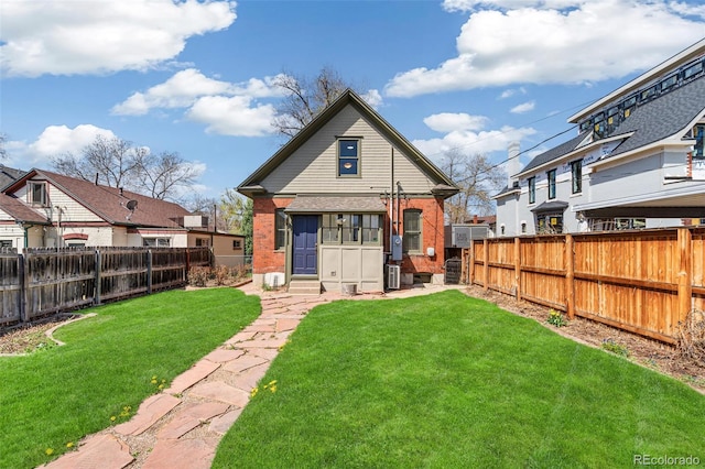 2826 Quitman St, Denver, CO 80212 - back of property featuring a fenced backyard and brick siding