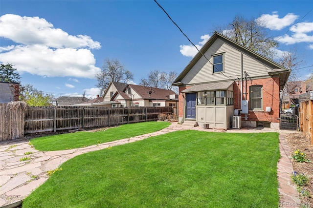 2826 Quitman St, Denver, CO 80212 - back of property with brick siding, a fenced backyard, and entry steps