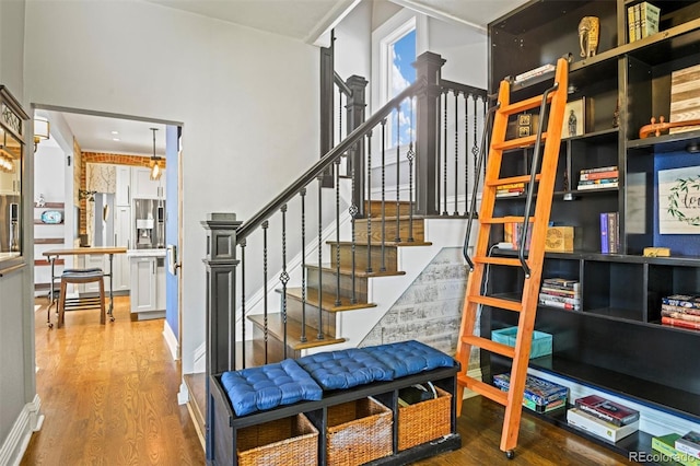 3811 N Clay St, Denver, CO 80211 - staircase featuring baseboards and wood finished floors