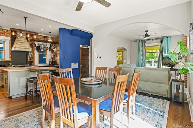 3811 N Clay St, Denver, CO 80211 - dining area featuring arched walkways, wood finished floors, and a ceiling fan
