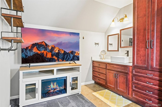3811 N Clay St, Denver, CO 80211 - bathroom featuring vanity, baseboards, and lofted ceiling