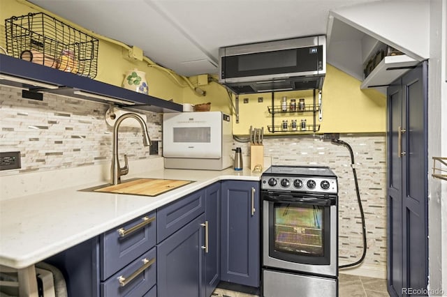 3811 N Clay St, Denver, CO 80211 - kitchen featuring a sink, light countertops, blue cabinetry, and appliances with stainless steel finishes