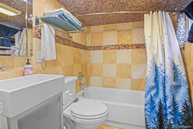 3811 N Clay St, Denver, CO 80211 - bathroom featuring a sink, toilet, tile walls, and shower / bath combo with shower curtain