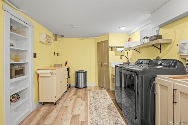 3811 N Clay St, Denver, CO 80211 - clothes washing area with baseboards, cabinet space, independent washer and dryer, and light wood-style floors
