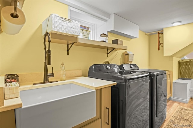 3811 N Clay St, Denver, CO 80211 - laundry area with a sink, washer and dryer, laundry area, and light wood-type flooring