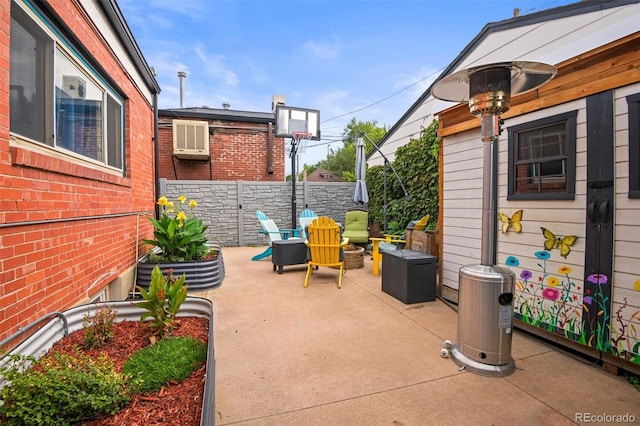 3811 N Clay St, Denver, CO 80211 - view of patio / terrace featuring an AC wall unit and fence