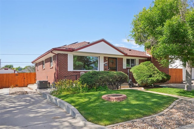 11349 Downing Dr, Northglenn, CO 80233 - view of front of property with brick siding and an outdoor fire pit
