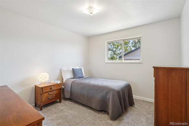 11349 Downing Dr, Northglenn, CO 80233 - bedroom featuring light colored carpet and baseboards