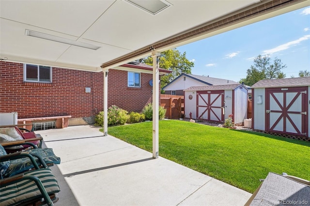 11349 Downing Dr, Northglenn, CO 80233 - view of patio / terrace with a shed