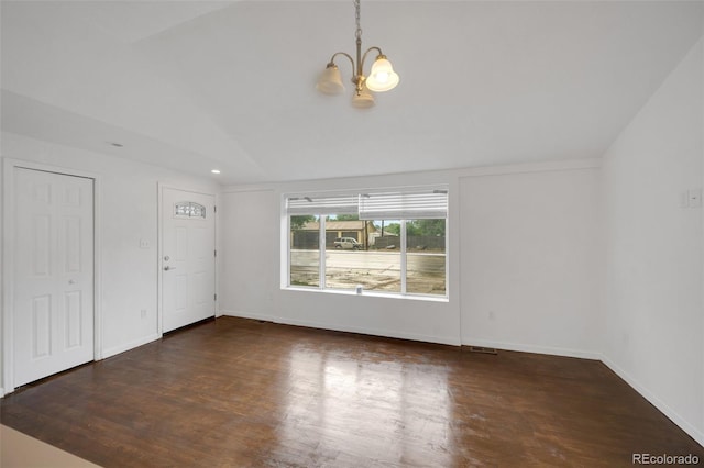 7010 W 44th Ave, Wheat Ridge, CO 80033 - unfurnished living room with vaulted ceiling, a chandelier, and wood finished floors