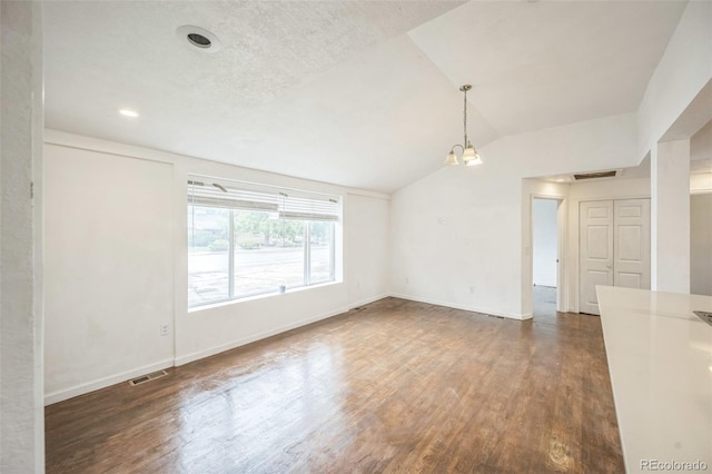7010 W 44th Ave, Wheat Ridge, CO 80033 - unfurnished room featuring wood finished floors and lofted ceiling