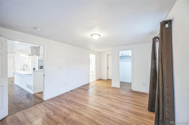 7010 W 44th Ave, Wheat Ridge, CO 80033 - unfurnished room featuring light wood-style floors and a smoke detector