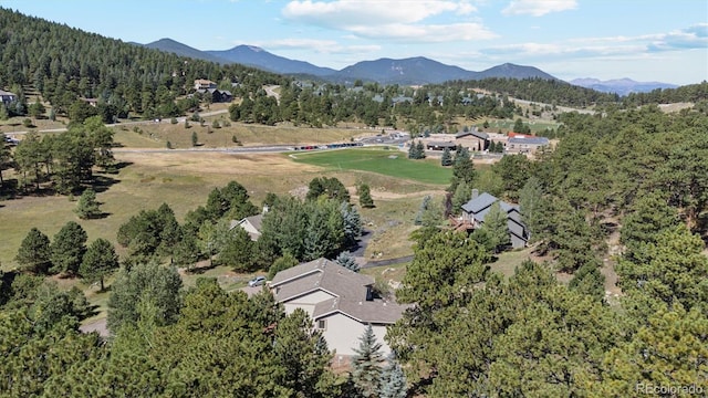 birds eye view of property with a mountain view