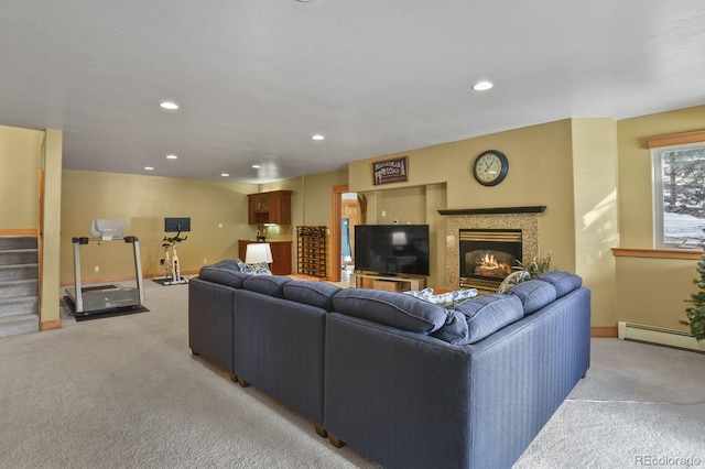 carpeted living room featuring a baseboard heating unit