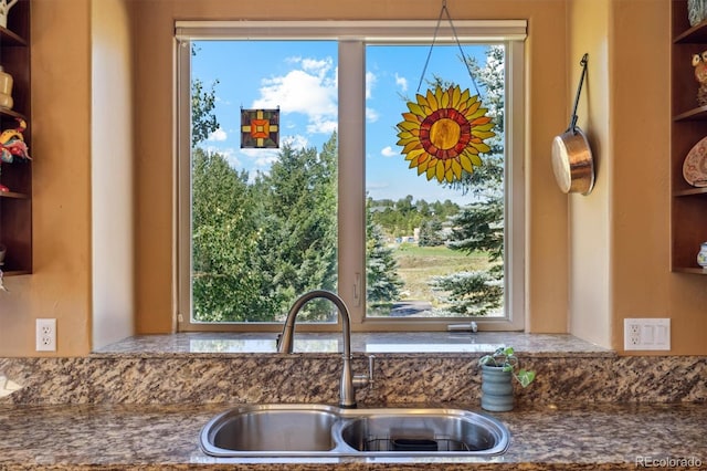 kitchen featuring a wealth of natural light and sink