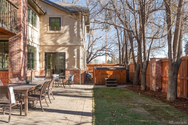 view of patio with a hot tub