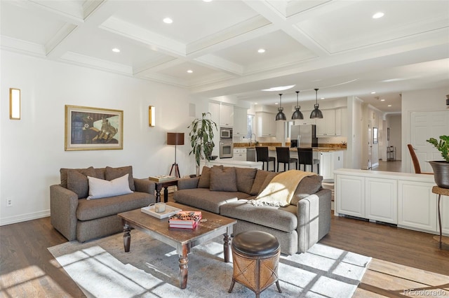 living room featuring beamed ceiling, dark hardwood / wood-style flooring, crown molding, and coffered ceiling