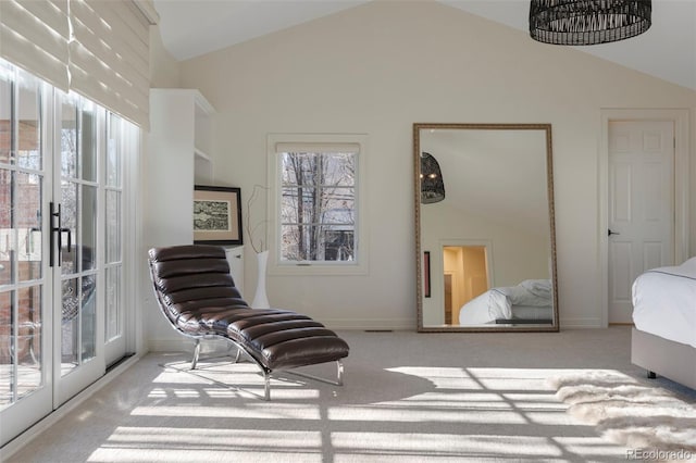 bedroom with light carpet and lofted ceiling