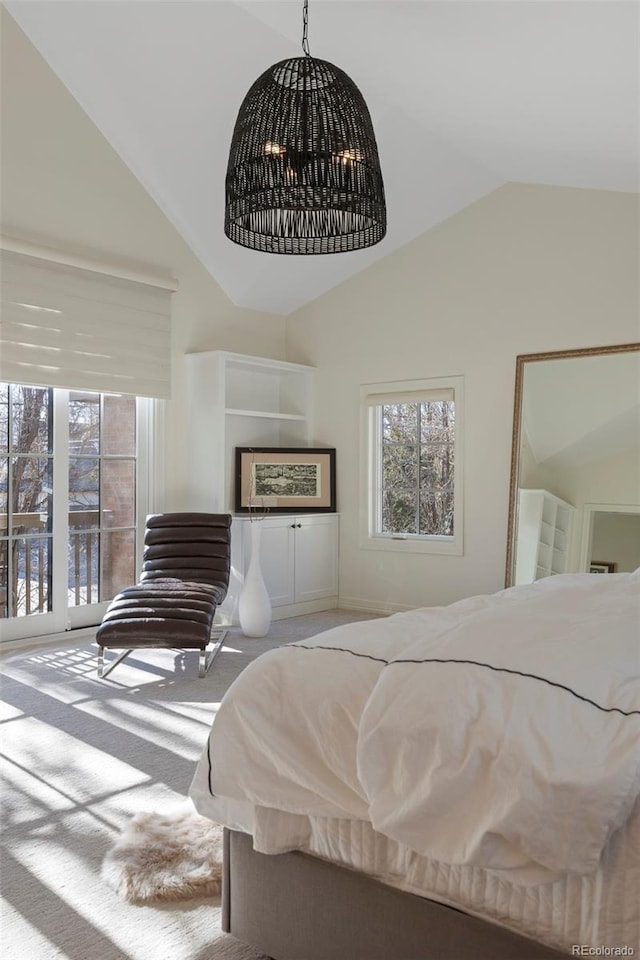 carpeted bedroom featuring vaulted ceiling