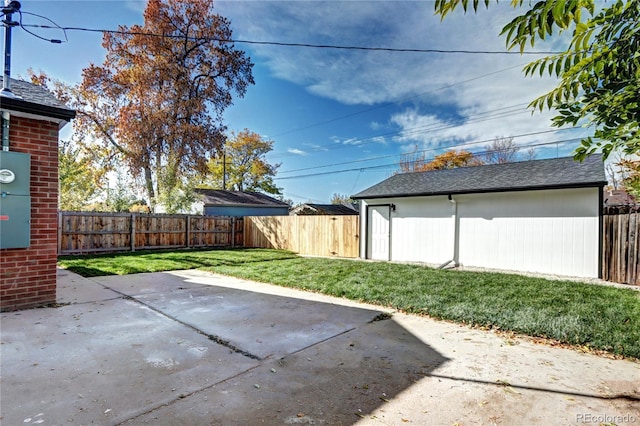 view of patio / terrace featuring an outbuilding and a fenced backyard