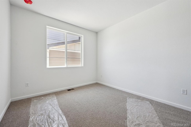 9061 Telluride Ct, Commerce City, CO 80022 - spare room featuring carpet flooring and baseboards