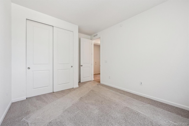 9061 Telluride Ct, Commerce City, CO 80022 - unfurnished bedroom featuring light carpet, baseboards, and a closet