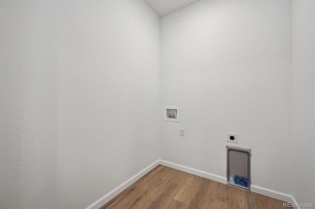9061 Telluride Ct, Commerce City, CO 80022 - washroom featuring hookup for an electric dryer, washer hookup, light wood-style floors, and baseboards