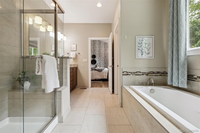 1235 S Balsam St, Lakewood, CO 80232 - ensuite bathroom with a bath, vanity, tile patterned floors, a shower stall, and recessed lighting