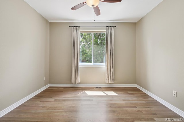 1235 S Balsam St, Lakewood, CO 80232 - unfurnished room with ceiling fan, wood finished floors, and baseboards
