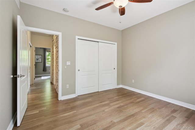 1235 S Balsam St, Lakewood, CO 80232 - unfurnished bedroom with light wood-type flooring, baseboards, a closet, and ceiling fan